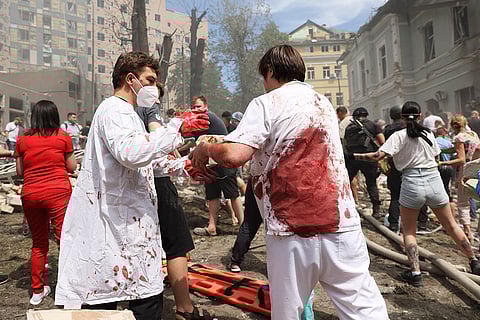 Rescuers at children hospital Okhmadit in Kyiv